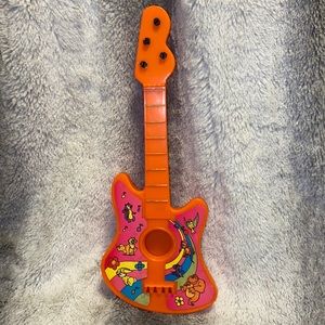 Vintage mini plastic guitar